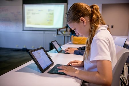 SFC student working on a tablet in class